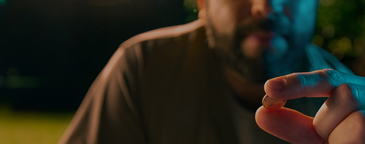 Man contemplating the luck a penny will bring him.