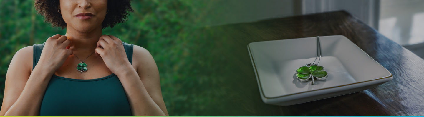 [Left] Woman contemplating the luck her four-leaf clover necklace could bring her. [Right] Four-leaf clover necklace left behind. 